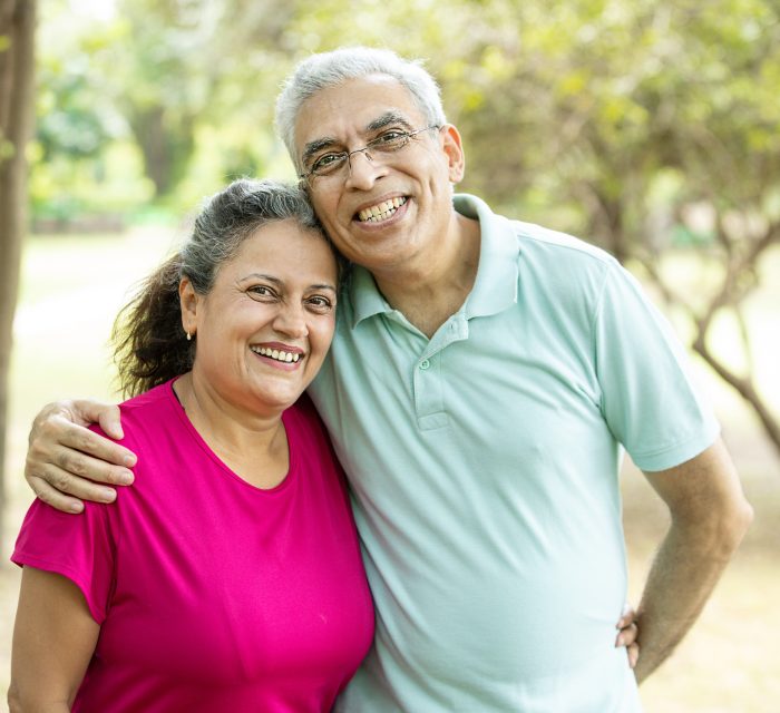 Portrait of Happy indian senior couple at summer park. Old Asian man and woman standing outdoor smiling. retirement life, Portrait of Happy indian senior couple at summer park. Old Asian man and woman standing outdoor smiling. retirement life,